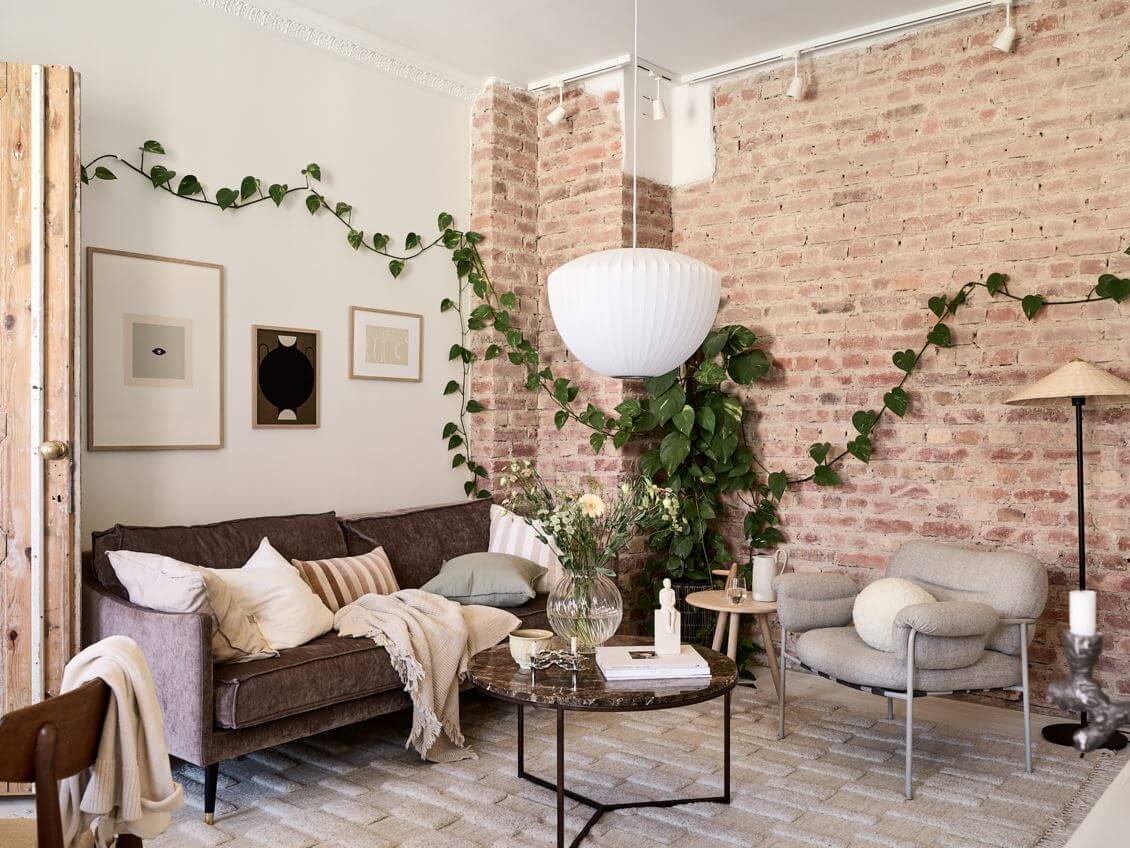 A Swedish Apartment with an Exposed Brick Wall 2 scandinavian-living-room-brick-wall-large-rug-nordroom