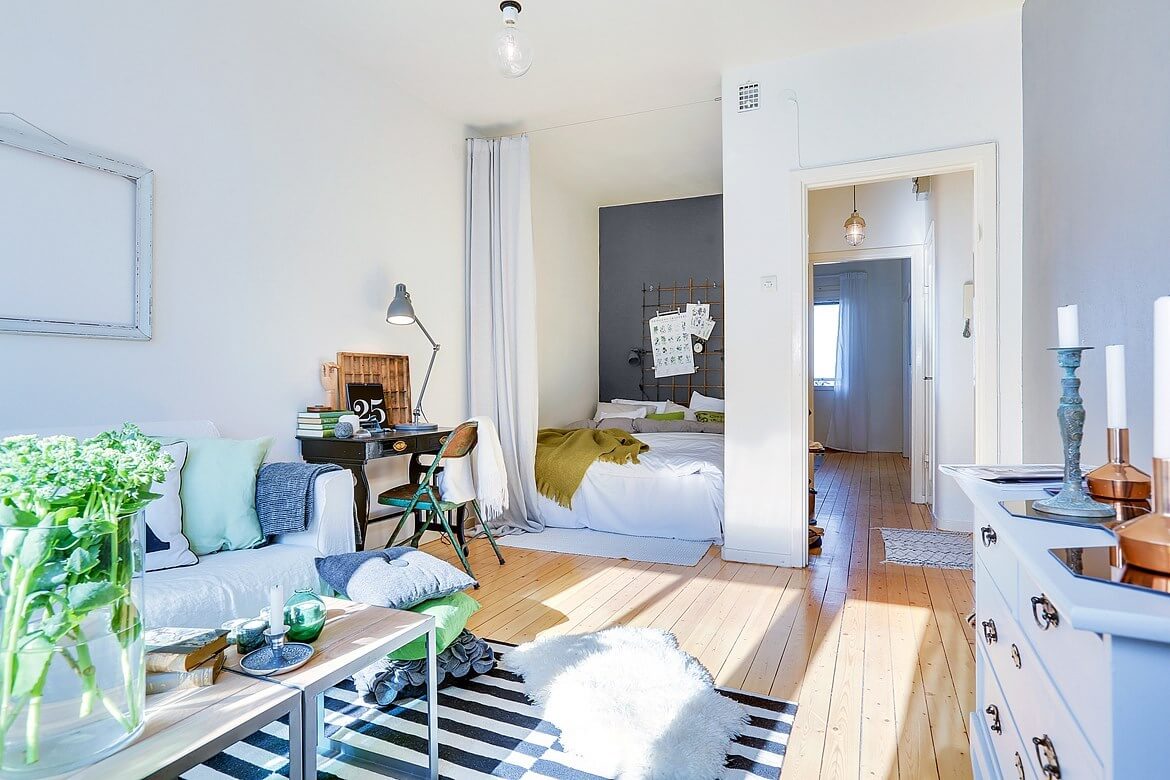 53 Studio Apartments with a Curtain Room Divider 55 scandinavian-studio-striped-rug-curtain-room-divider-nordroom