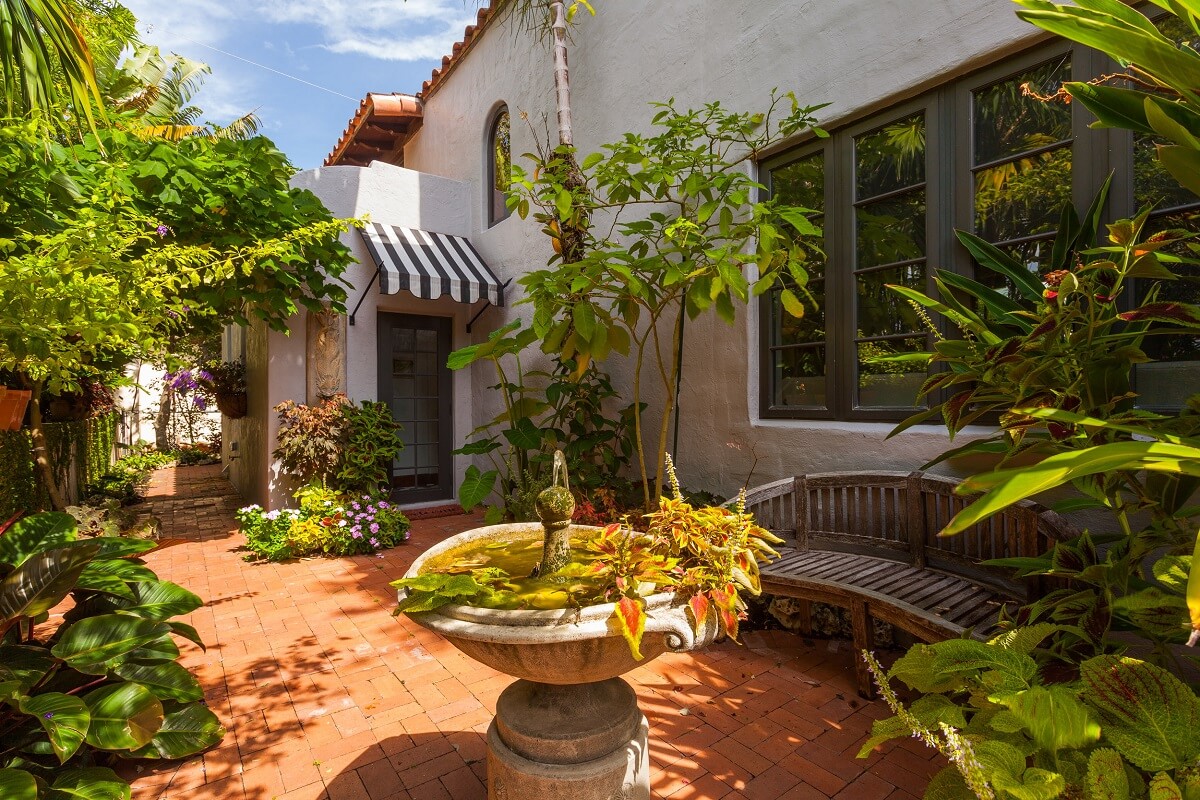 A Beautiful Spanish Style Home in Florida 28 secluded-garden-with-bench-nordroom