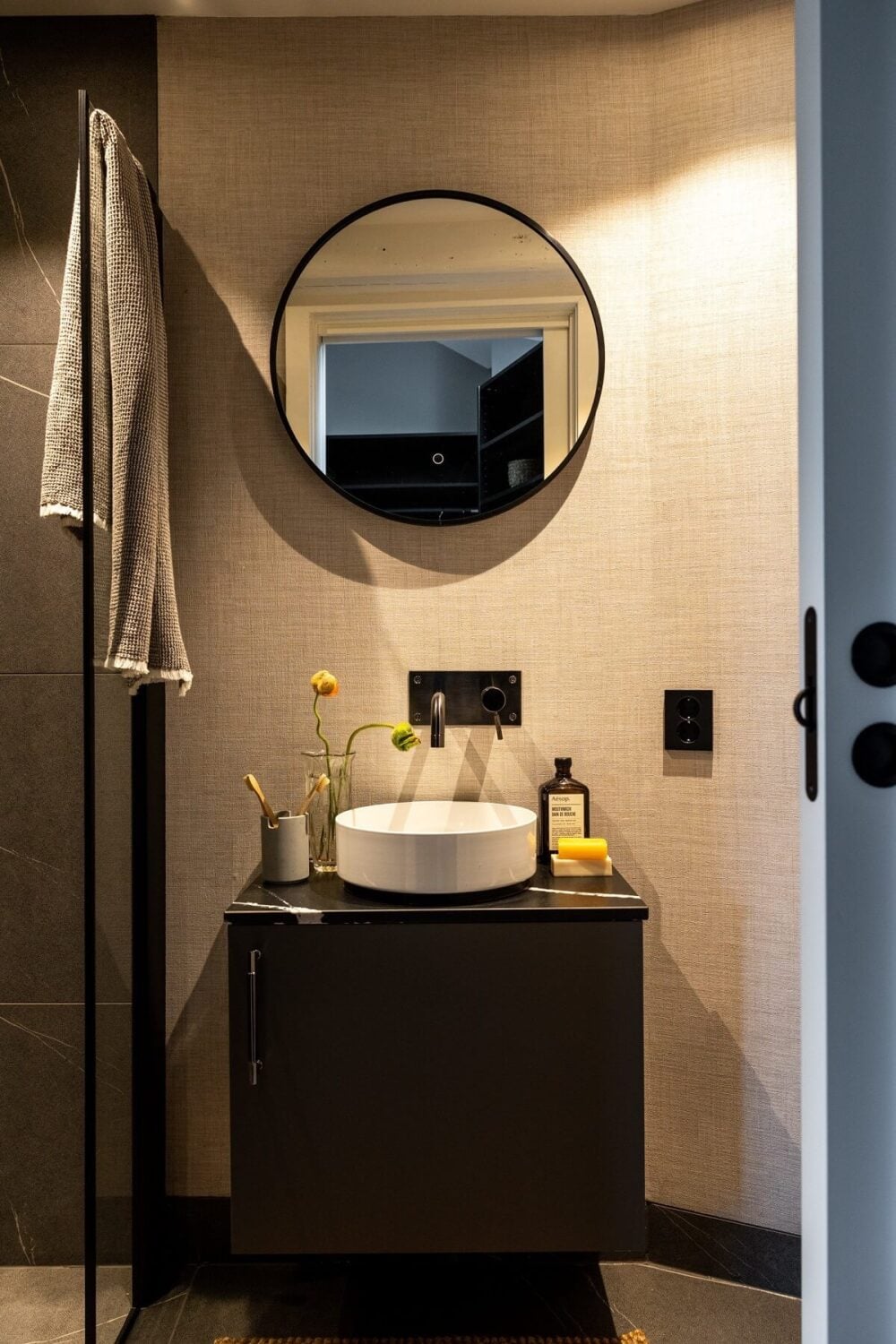 A Bright Penthouse Apartment in Oslo 13 small-bathroom-shower-round-mirror-black-fittings-nordroom