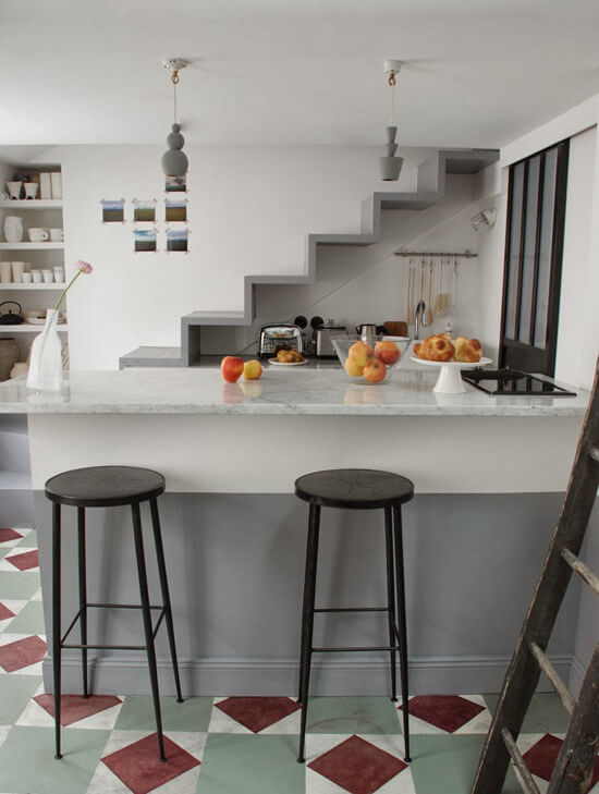 43 Ideas To Divide a Studio Apartment Into Multiple Rooms 38 stairs leading to loft area above kitchen room divider ideas studio apartment nordroom 43 Ideas To Divide a Studio Apartment Into Multiple Rooms