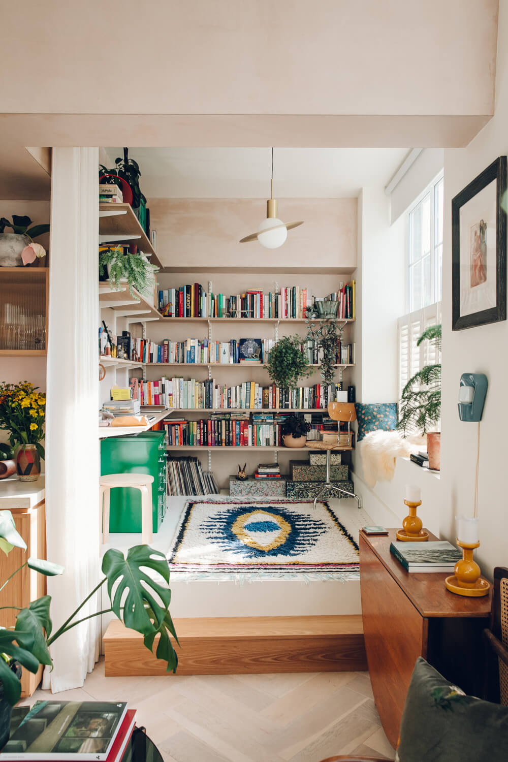53 Studio Apartments with a Curtain Room Divider 28 studio-apartment-bookshelves-raised-platform-curtain-divider-nordroom