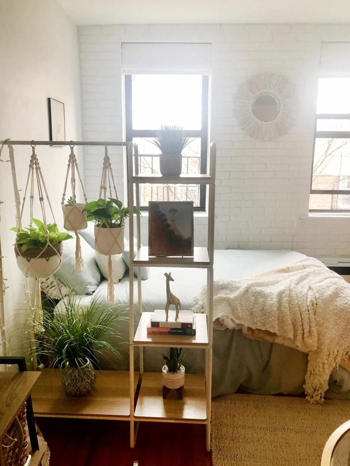 43 Ideas To Divide a Studio Apartment Into Multiple Rooms 26 studio apartment clothing rack with plants room divider nordroom