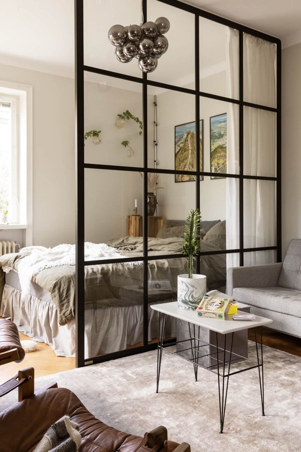 43 Ideas To Divide a Studio Apartment Into Multiple Rooms 21 studio-apartment-industrial-glass-wall-room-divider-nordroom
