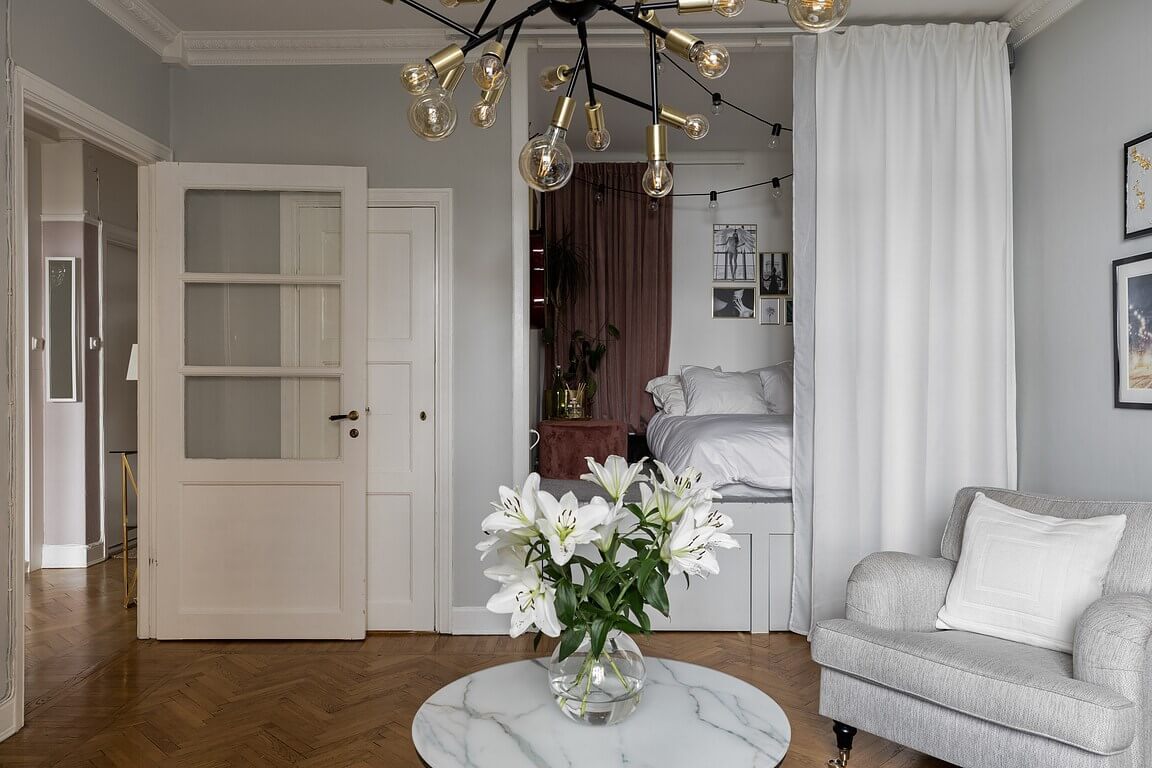 53 Studio Apartments with a Curtain Room Divider 25 studio-apartment-raised-bed-platform-underneath-storage-curtain-room-divider-nordroom