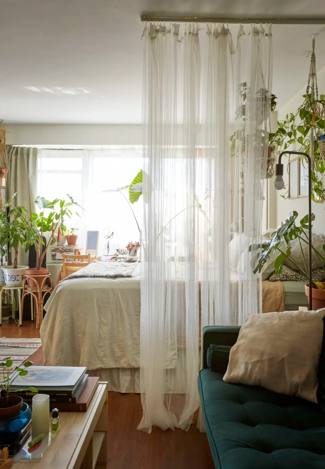 43 Ideas To Divide a Studio Apartment Into Multiple Rooms 42 studio-apartment-sheer-curtain-room-divider-nordroom