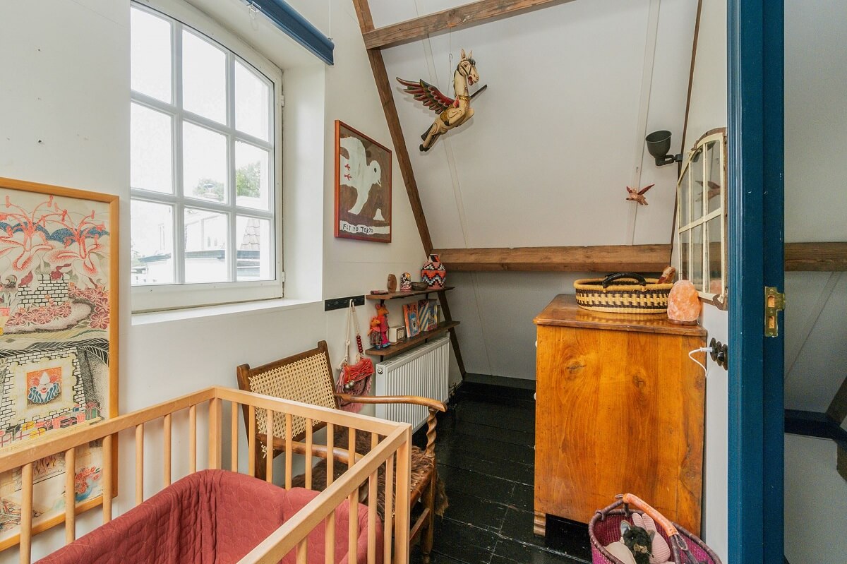 A Charming Colorful House in The Netherlands 14 tiny-nursery-slanted-ceiling-nordroom