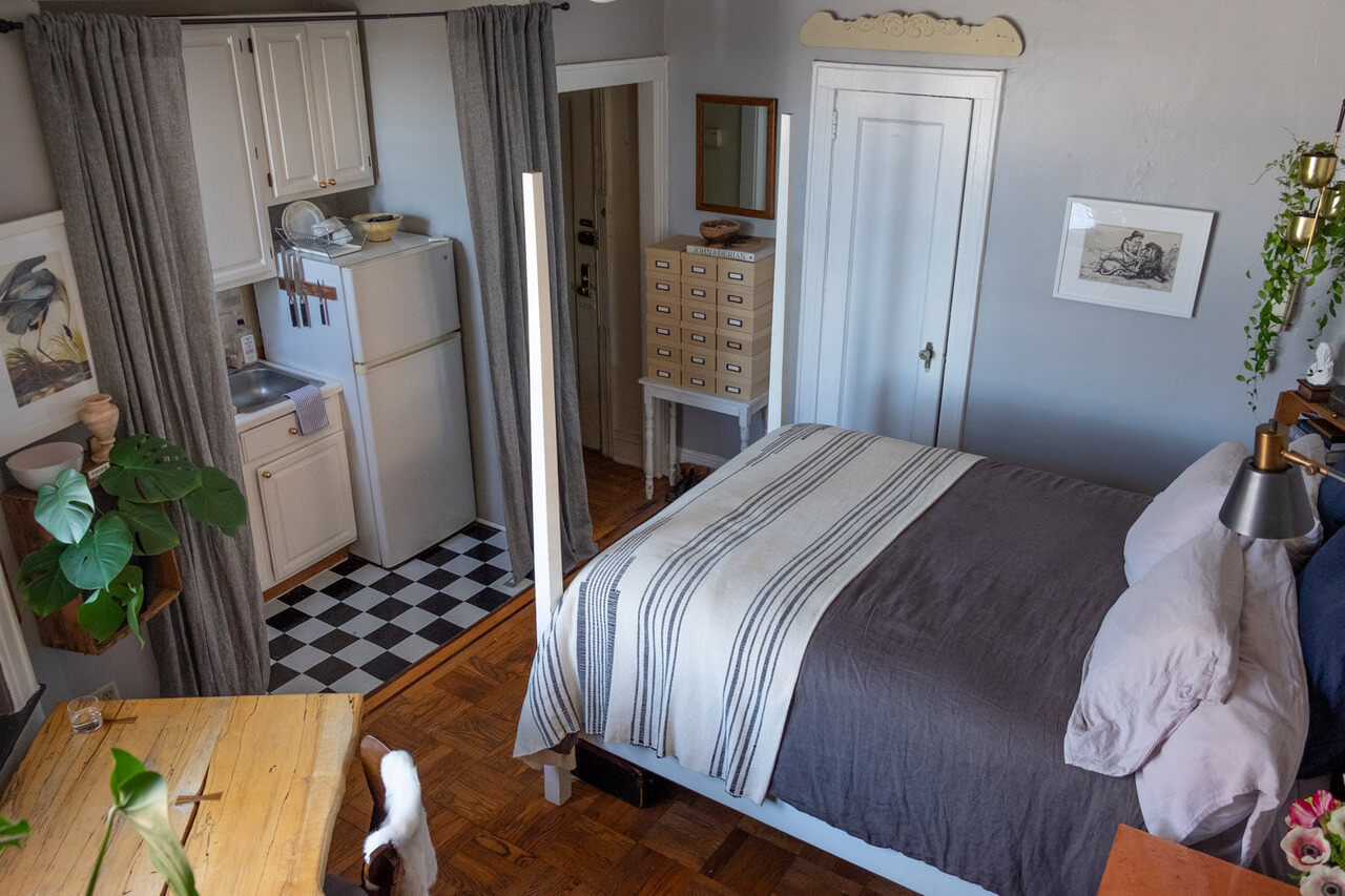 53 Studio Apartments with a Curtain Room Divider 37 tiny-studio-apartment-gray-curtain-room-divider-hides-kitchen-nordroom