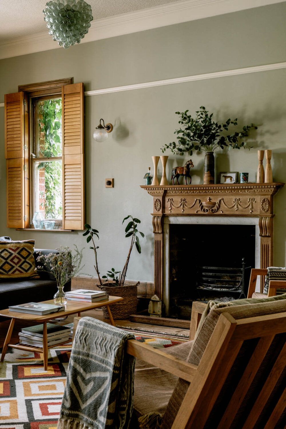 Best of 2023: Living Rooms 3 warm-living-room-bohemian-textures-carved-wooden-fireplace-nordroom