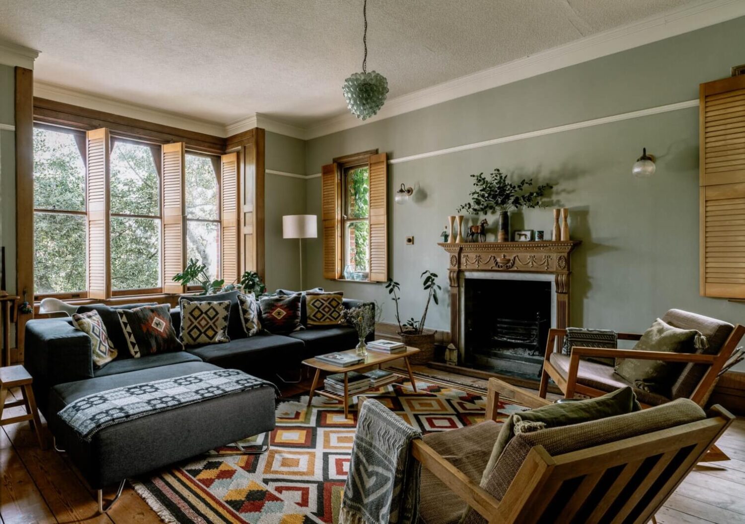 Best of 2023: Living Rooms 2 warm-living-room-colorful-textiles-wooden-shutters-nordroom