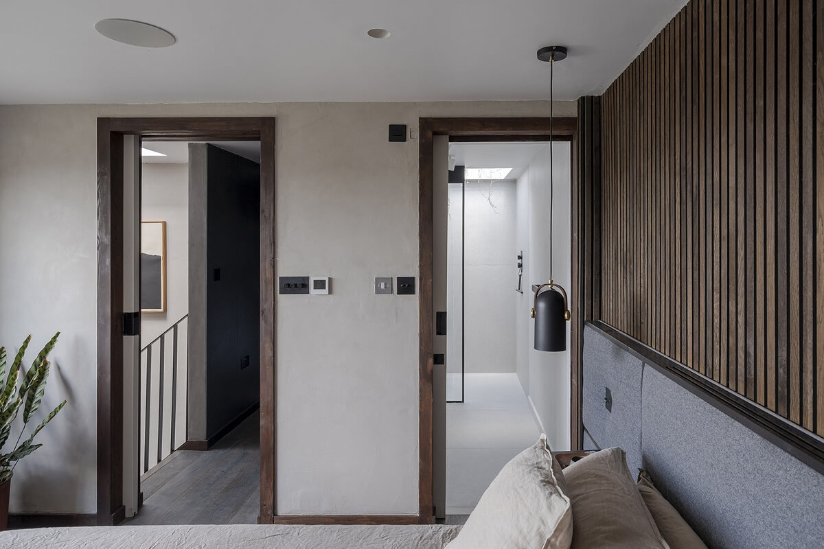 A Victorian House with Stylish Contemporary Interiors 15 wooden-accent-wall-master-bedroom-nordroom