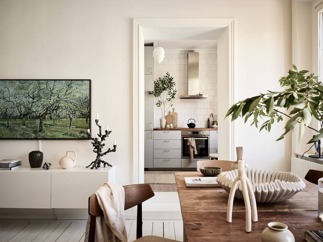 A Swedish Apartment with an Exposed Brick Wall 6 wooden-dining-table-kitchen-view-nordroom