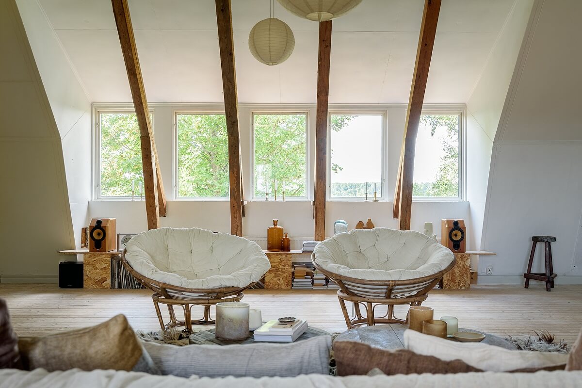 Natural Colors in a Swedish School Conversion 3 attic-living-room-exposed-wooden-beams-nordroom