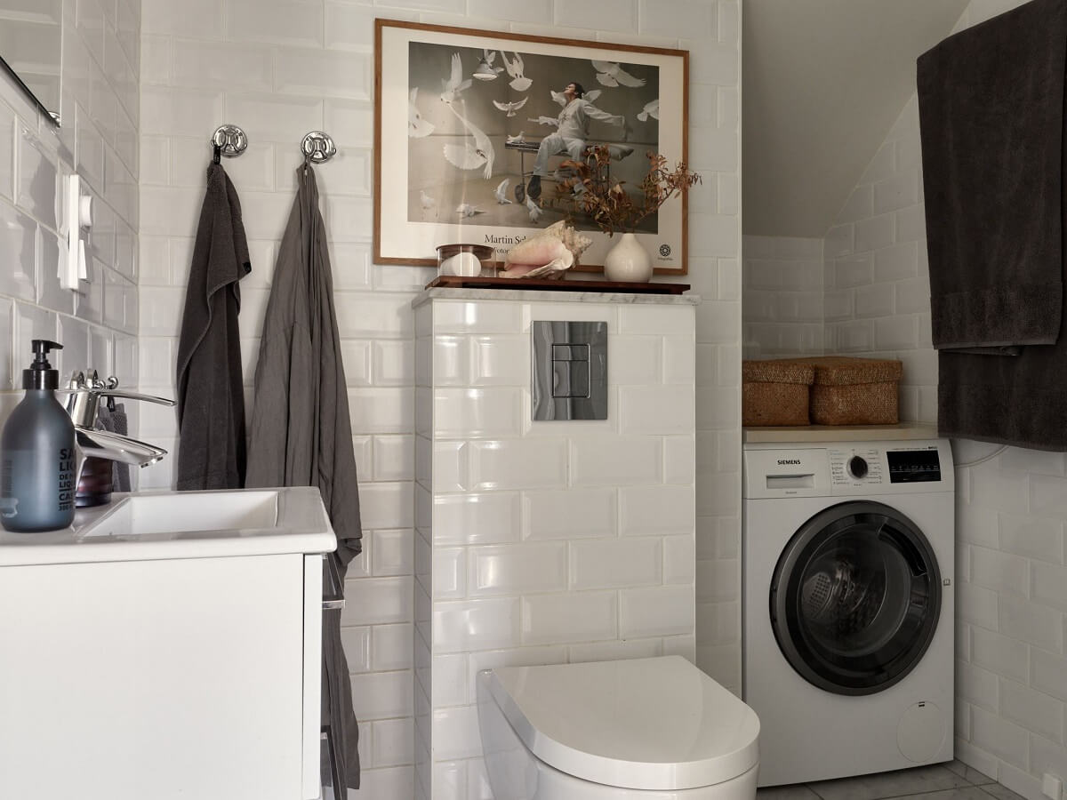 A Small Attic Apartment with Industrial Glass walls 17 bathroom-white-tiles-nordroom