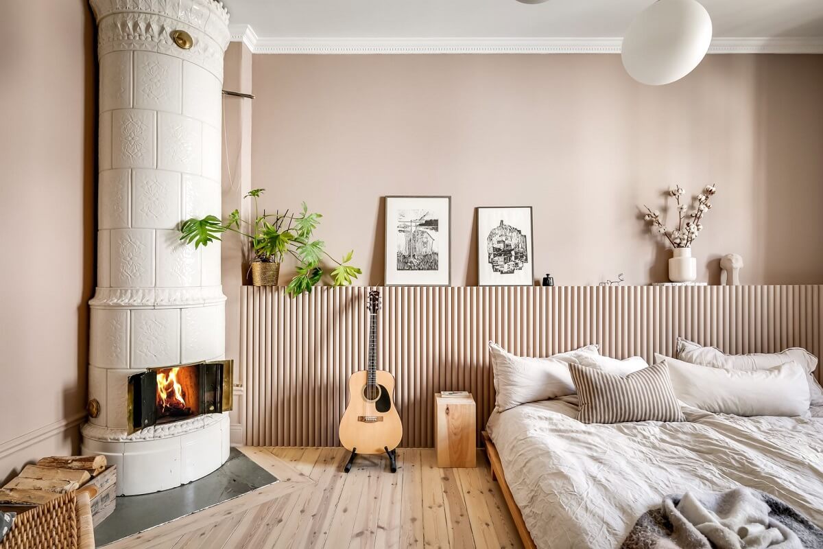 A Custom Headboard in a Light-Filled Swedish Apartment 20 bedroom-fireplace-accent-wall-headboard-nordroom