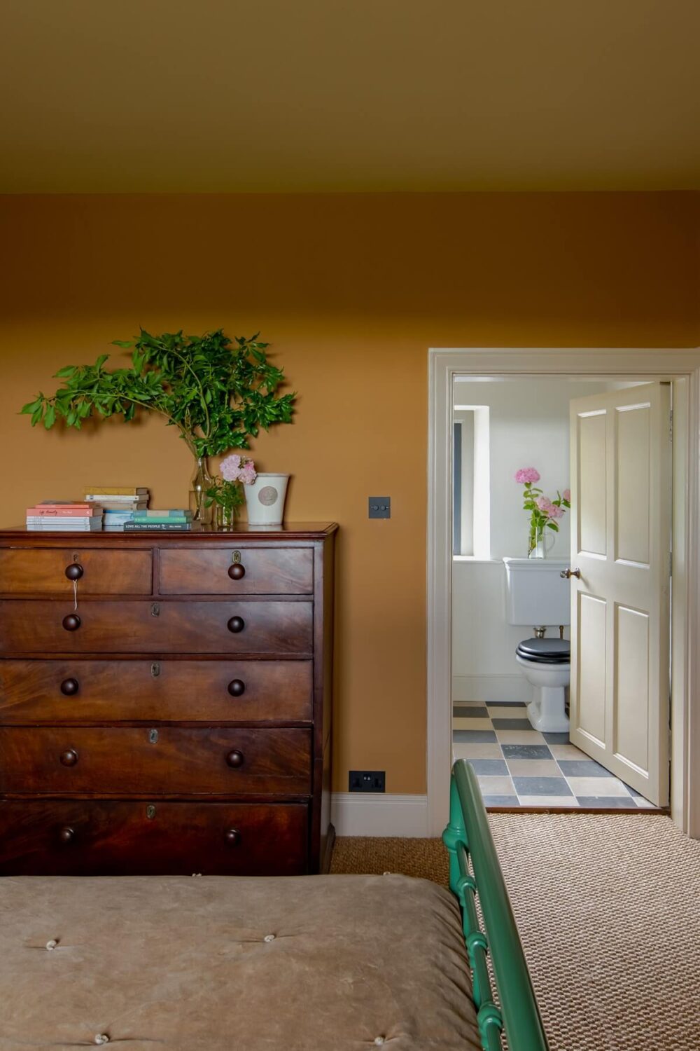 A Colorful Renovated Country House by Clarence & Graves 25 bedroom-orange-walls-en-suite-bathroom-nordroom