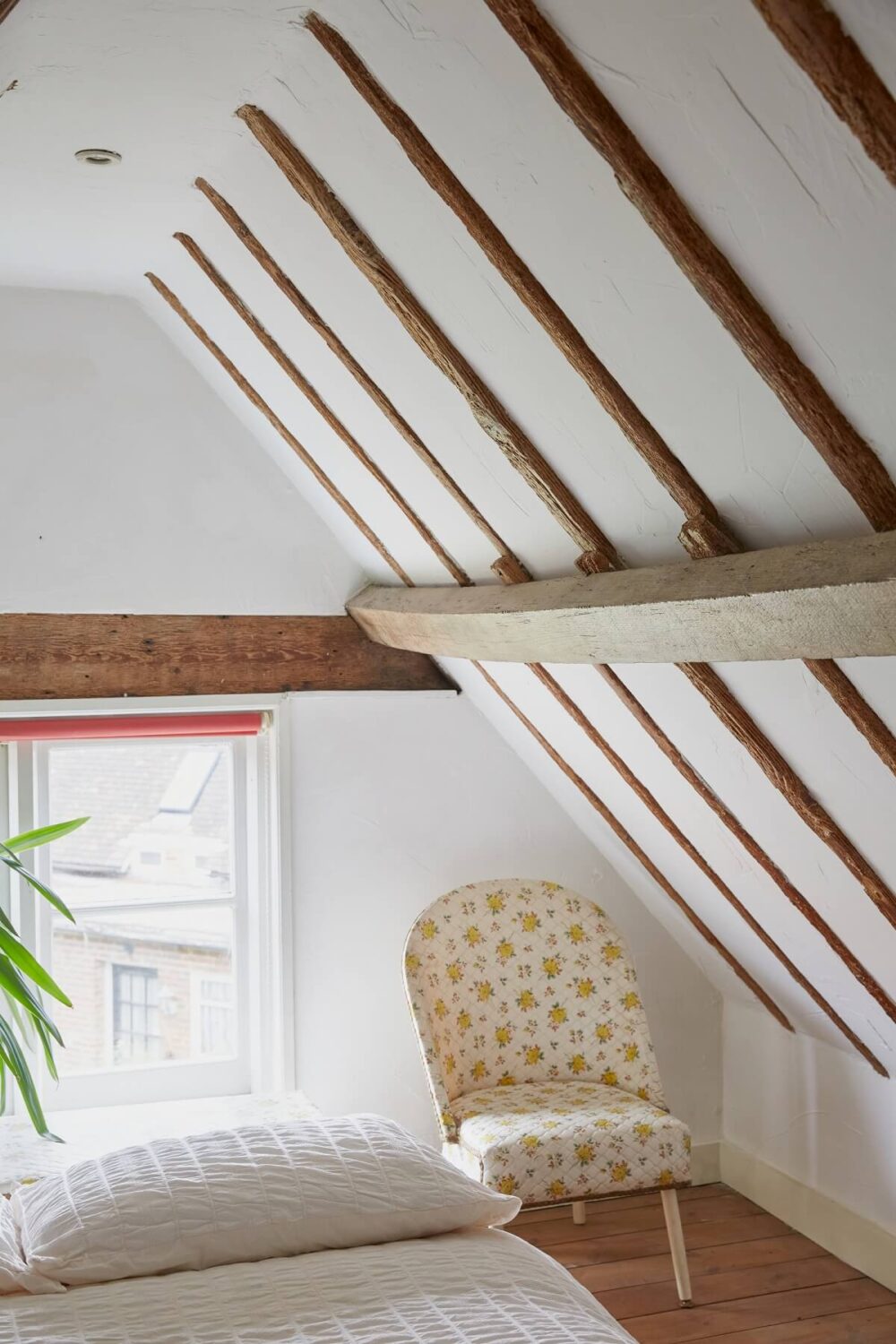 An English Cottage with a Coral Pink Kitchen 13 bedroom-slanted-ceilings-exposed-wooden-beams-nordroom