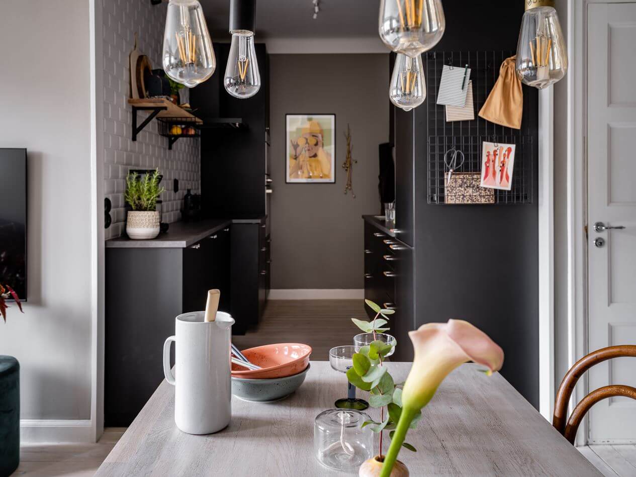 A Gray Nordic Apartment with a Terracotta Bedroom 13 black-galley-kitchen-nordroom