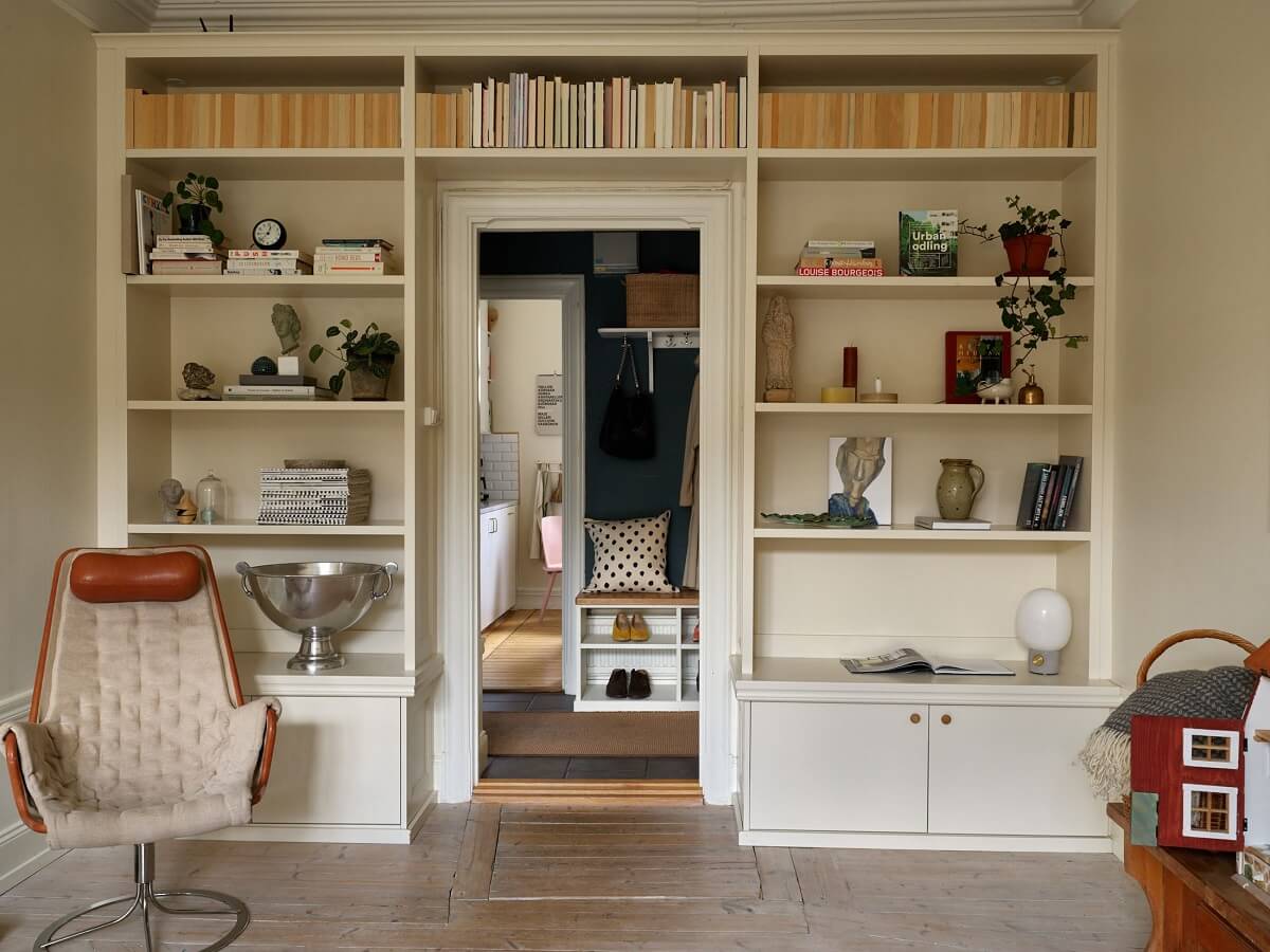 Beige Walls in a Serene Family Apartment in Sweden 4 built-in-bookshelves-beige-living-room-nordroom