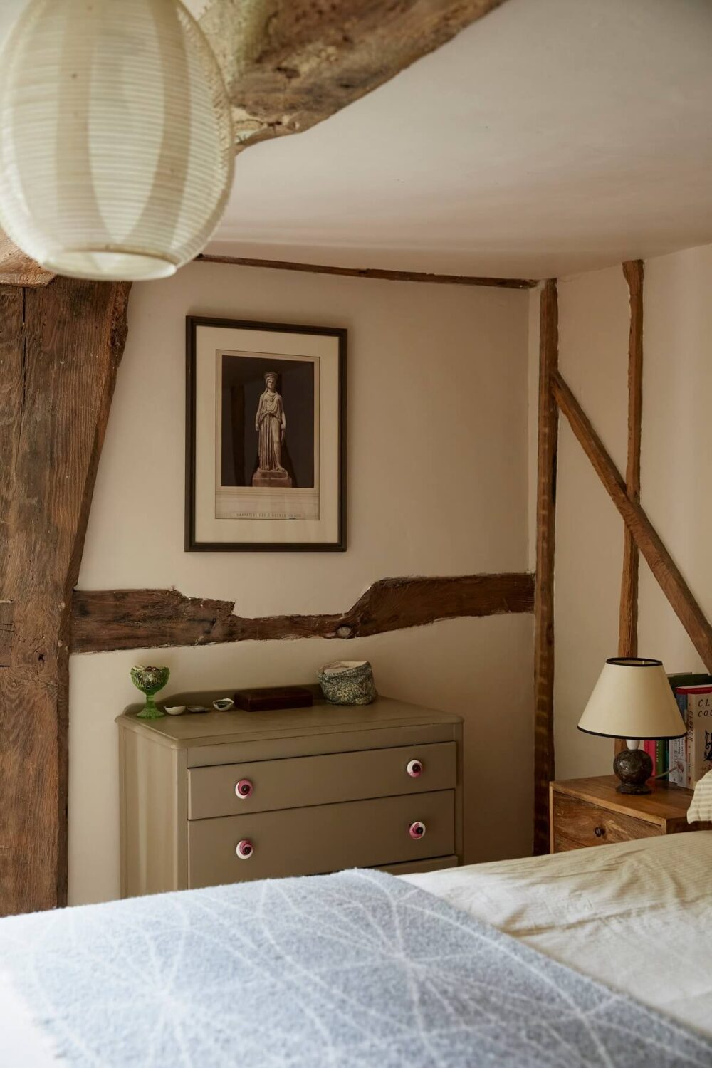 An English Cottage with a Coral Pink Kitchen 11 cottage-bedroom-exposed-wooden-beams-nordroom