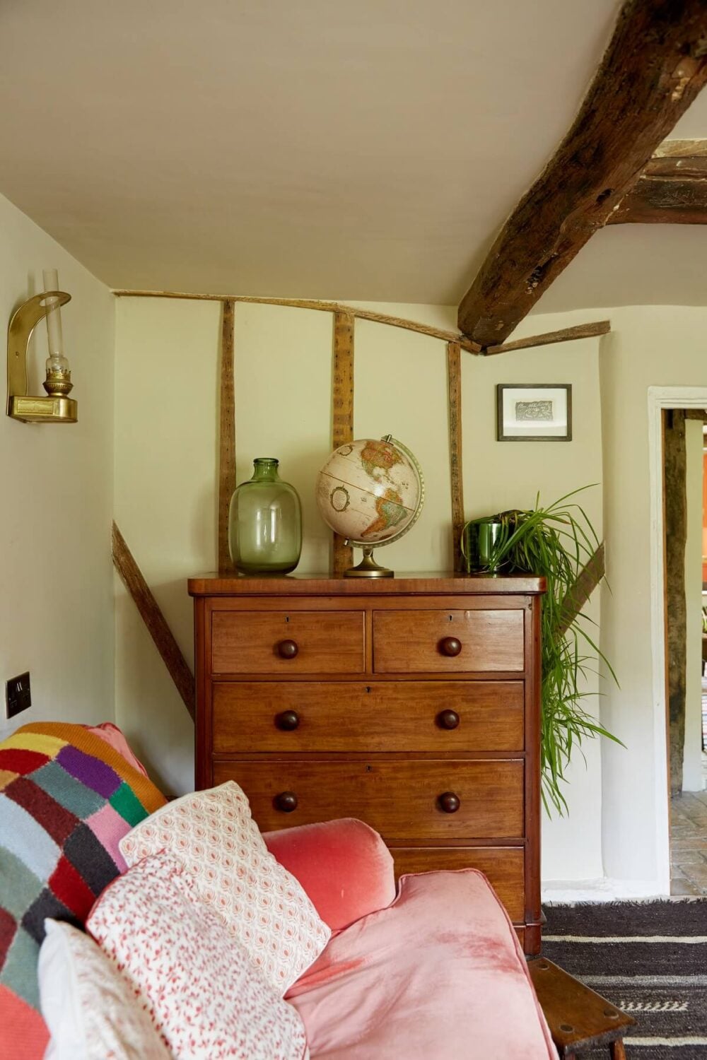 An English Cottage with a Coral Pink Kitchen 5 cottage-living-room-exposed-wooden-beams-nordroom