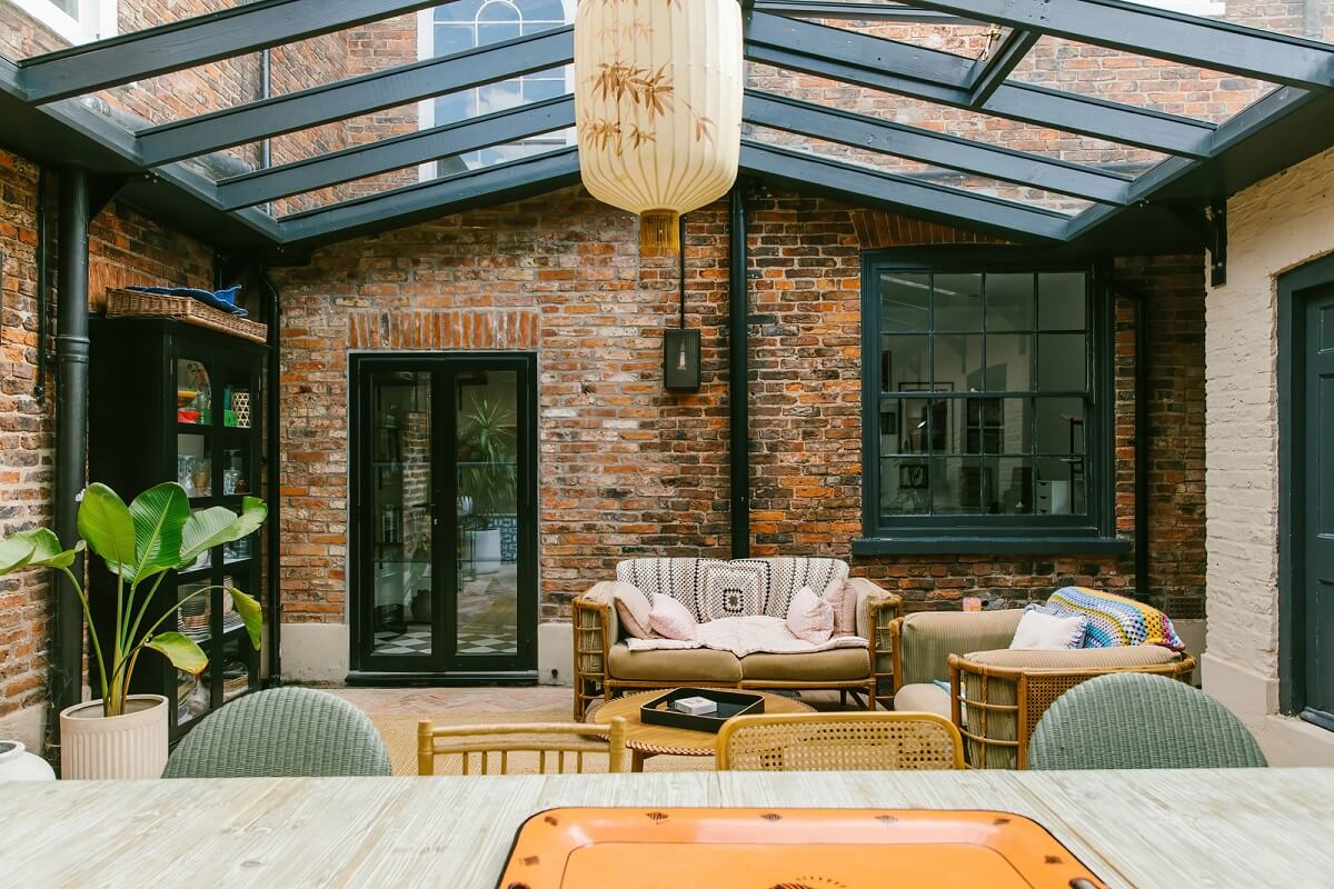 A Georgian House in England with Bold Color Pops 21 covered-patio-brick-walls-nordroom