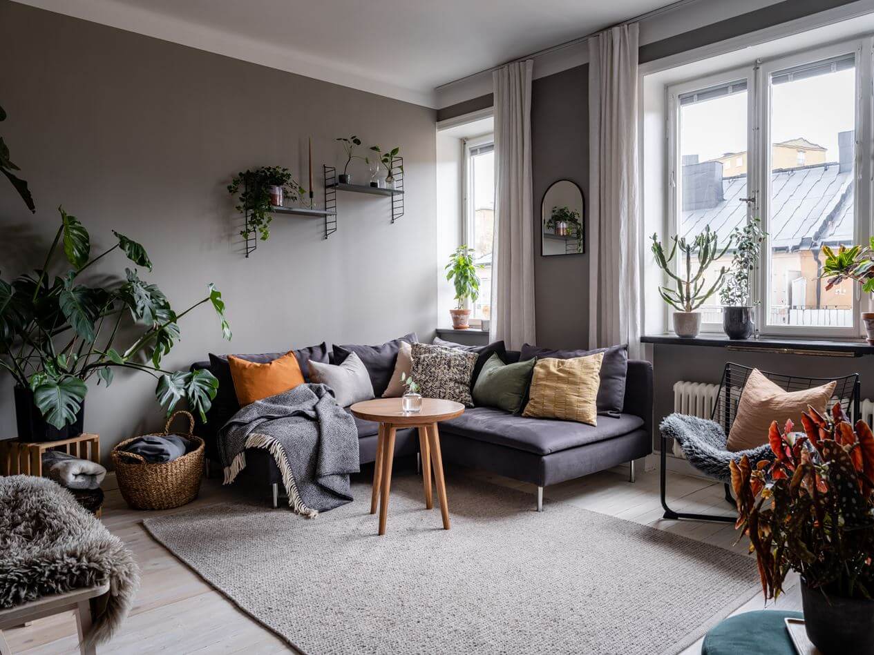 A Gray Nordic Apartment with a Terracotta Bedroom 4 cozy-living-room-layered-textiles-nordroom
