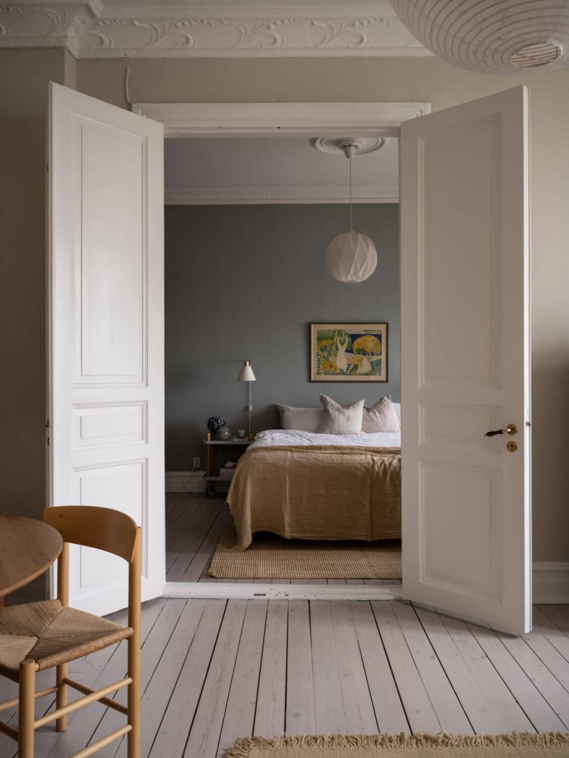 A Pink Kitchen Wall in a Scandinavian Apartment 6 double-doors-bedroom-nordroom