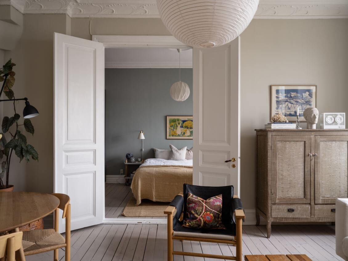 A Pink Kitchen Wall in a Scandinavian Apartment 5 double-wooden-doors-to-bedroom-nordroom