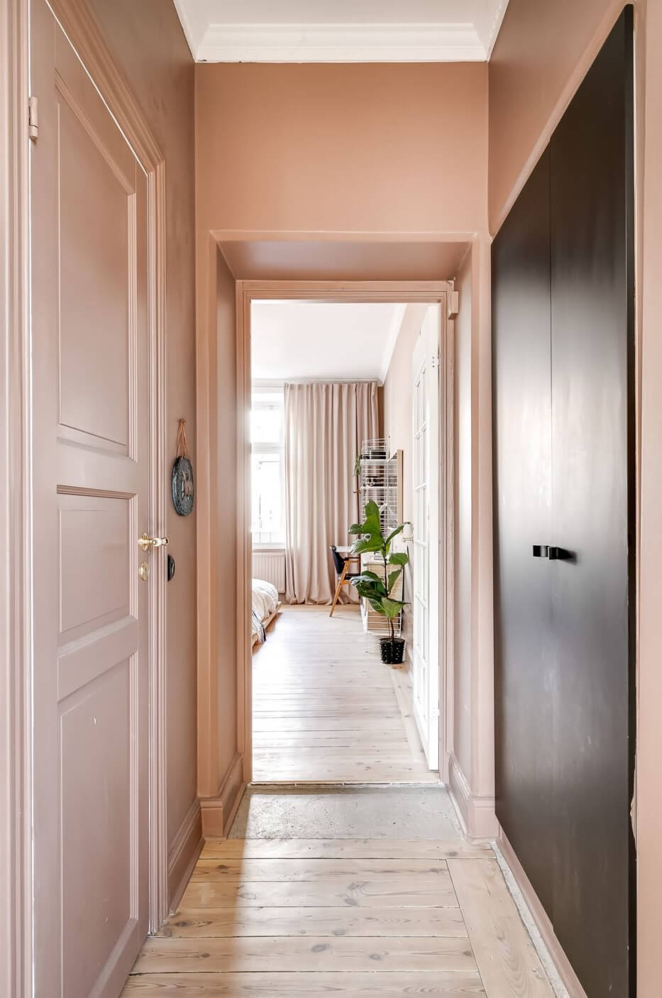A Custom Headboard in a Light-Filled Swedish Apartment 16 earthy-pink-hallway-nordroom