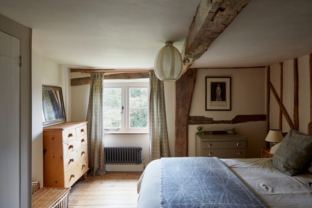 An English Cottage with a Coral Pink Kitchen 10 exposed-wooden-beams-english-cottage-bedroom-nordroom