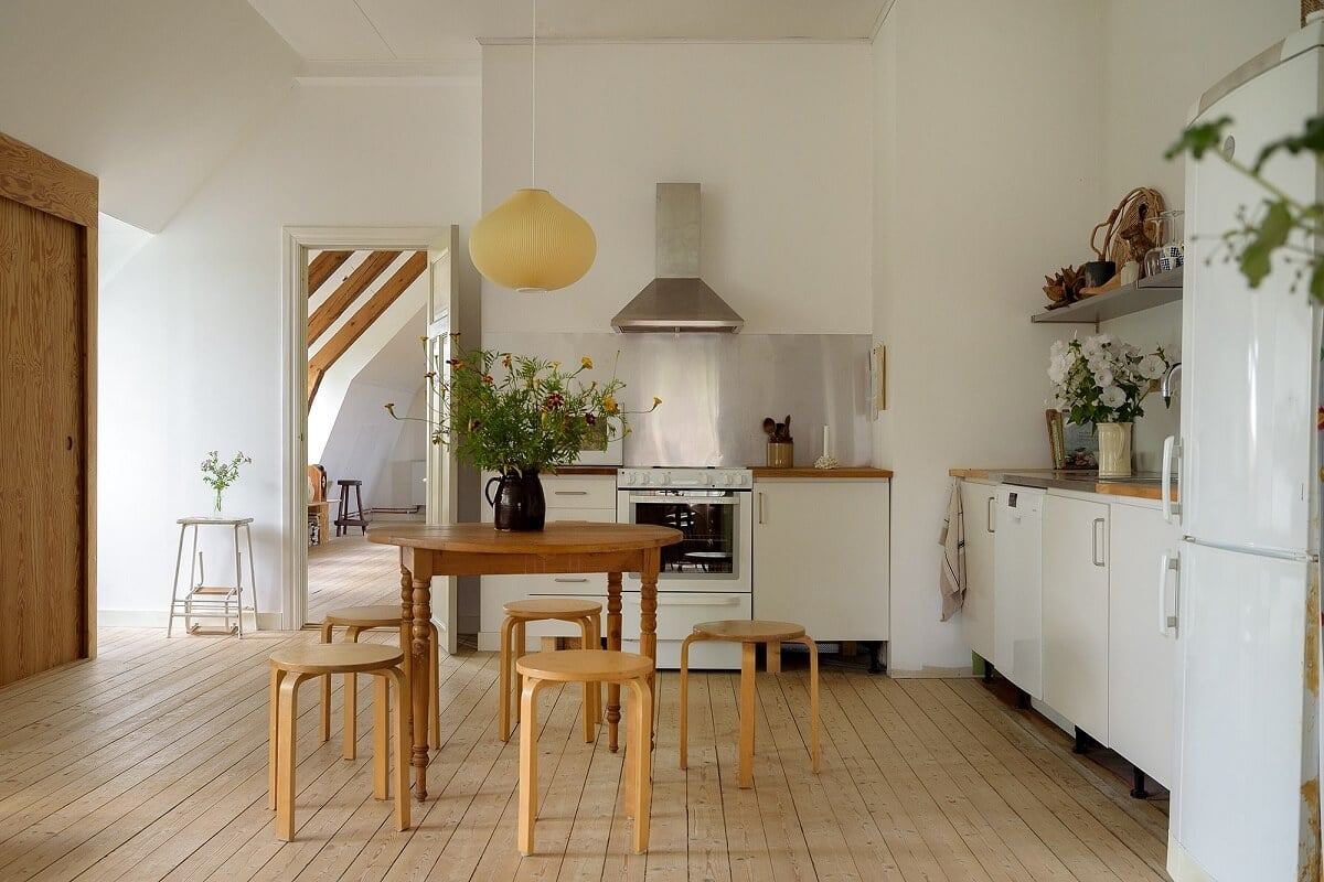 Natural Colors in a Swedish School Conversion 6 first-floor-living-room-kitchen-wooden-floor-nordroom
