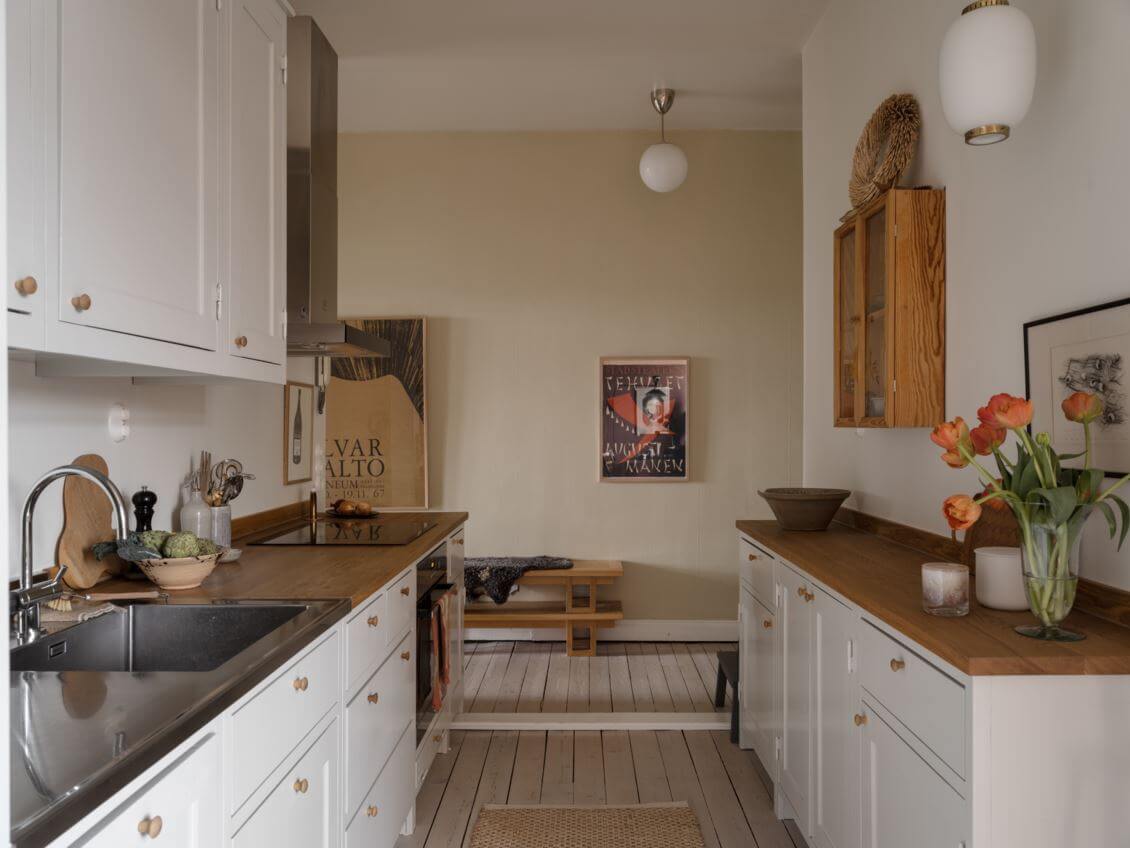 A Pink Kitchen Wall in a Scandinavian Apartment 14 galley-kitchen-light-gray-cabinets-nordroom