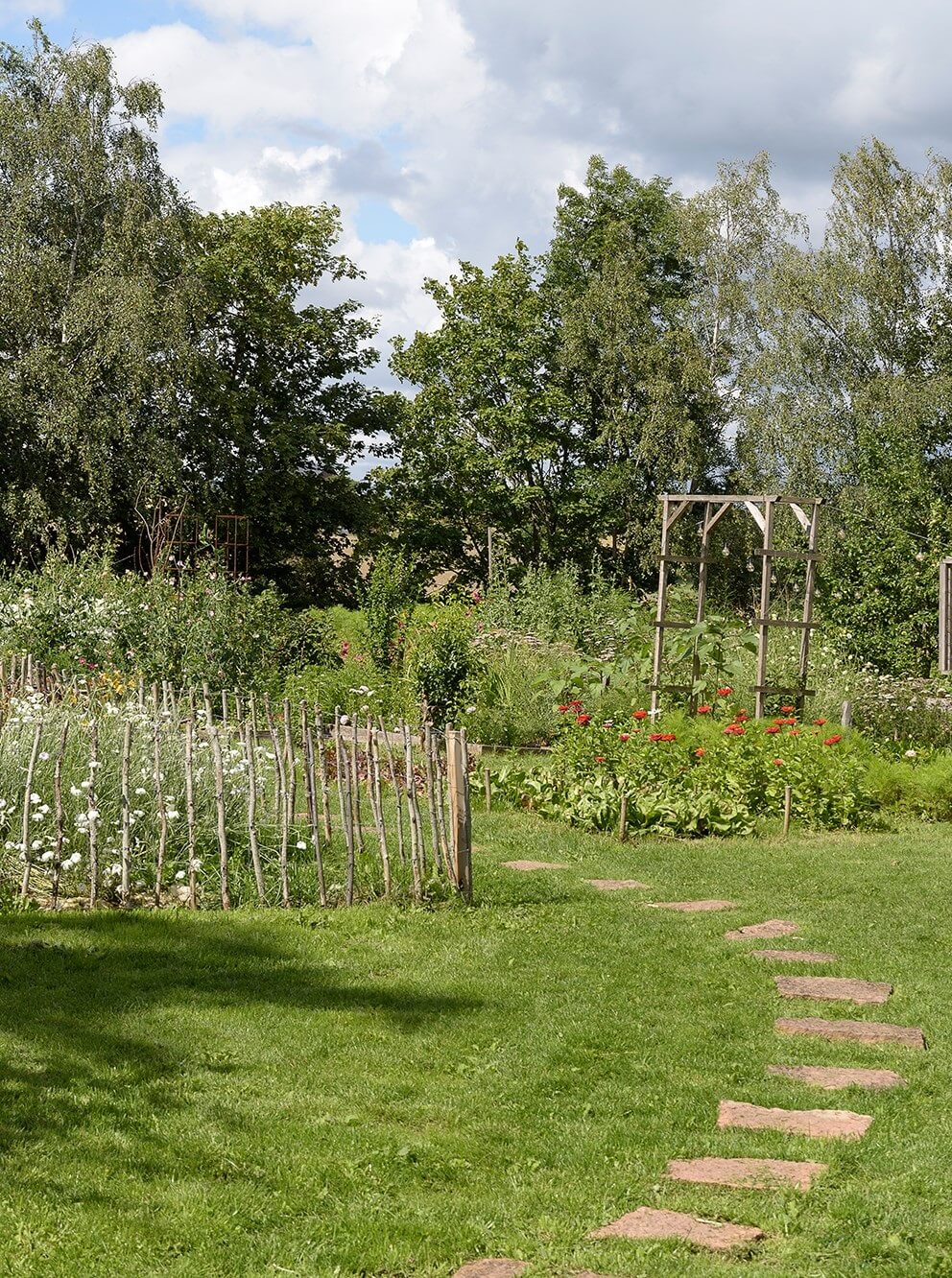 Natural Colors in a Swedish School Conversion 36 garden-vegetable-garden-trees-nordroom