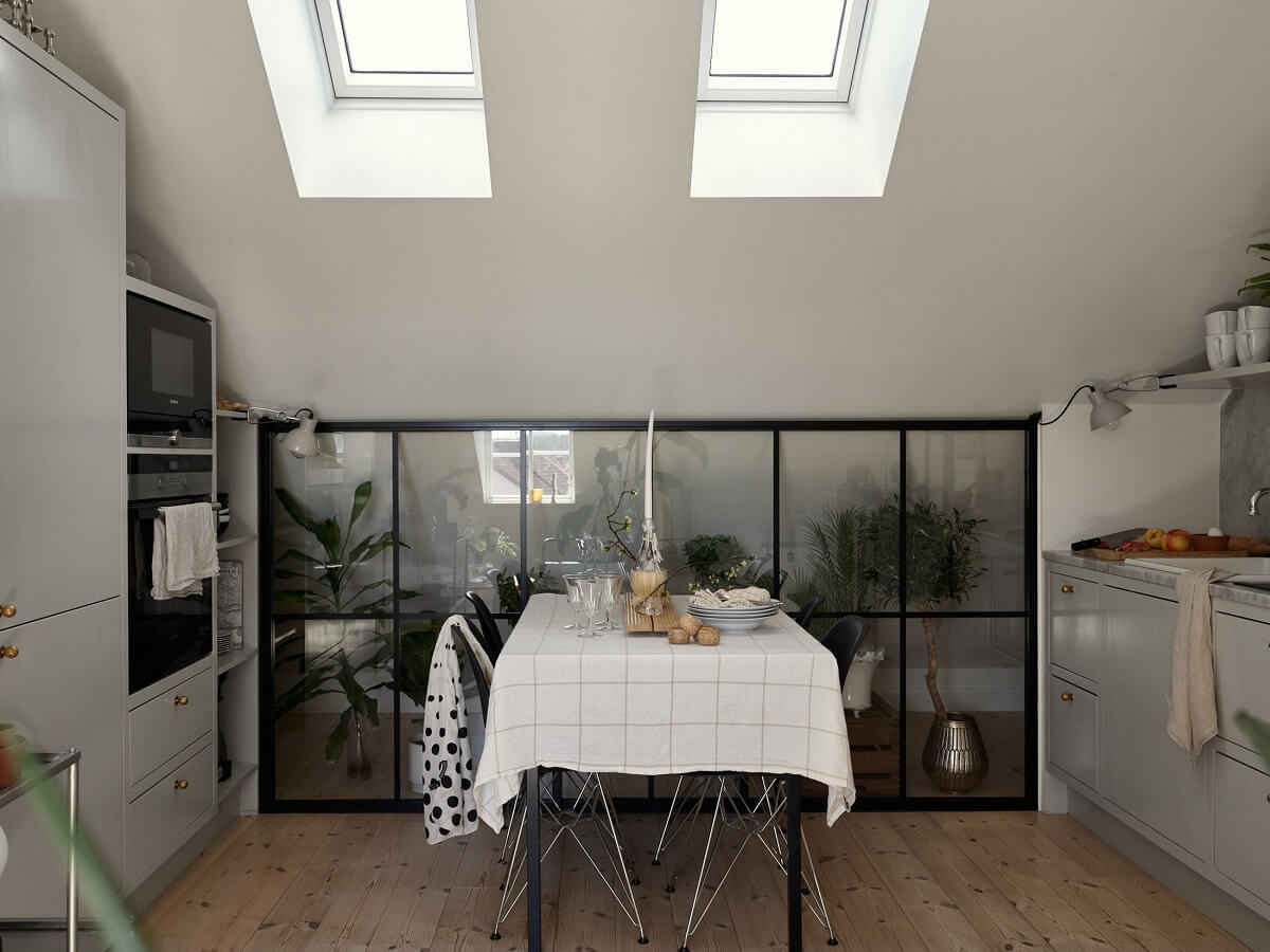A Small Attic Apartment with Industrial Glass walls 6 gray-galley-kitchen-dining-table-industrial-glass-wall-nordroom