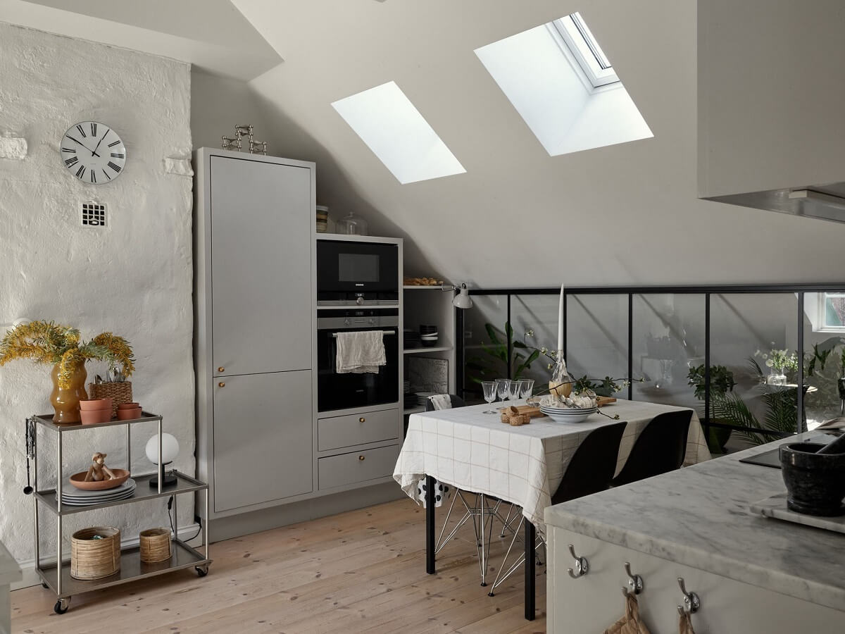 A Small Attic Apartment with Industrial Glass walls 9 gray-kitchen-skylights-industrial-glass-wall-nordroom