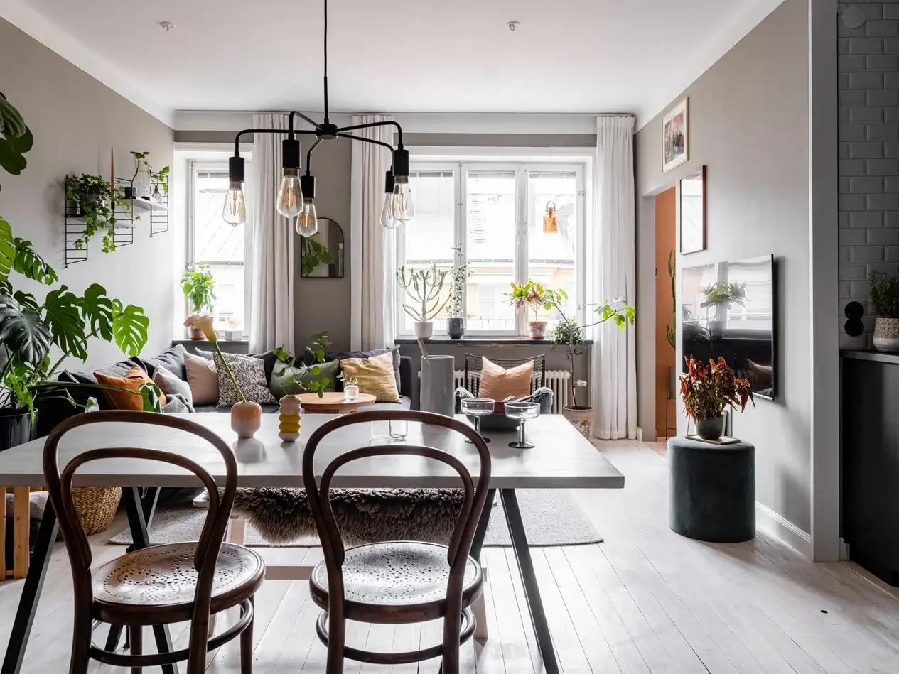 A Gray Nordic Apartment with a Terracotta Bedroom 3 gray-living-space-open-kitchen-nordroom