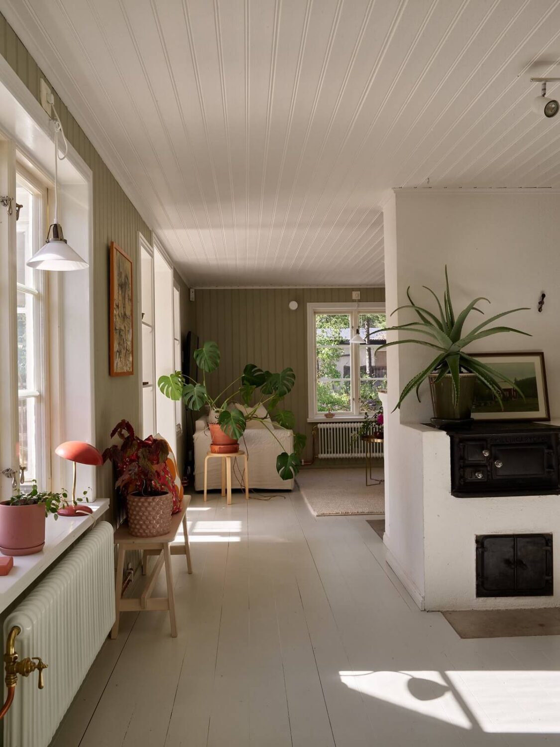 A Small Historic Swedish House with a Modern Extension 11 green-white-living-room-historic-house