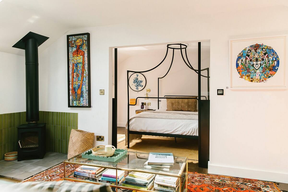 A Georgian House in England with Bold Color Pops 33 guest-house-canopy-bed-woodburner-nordroom