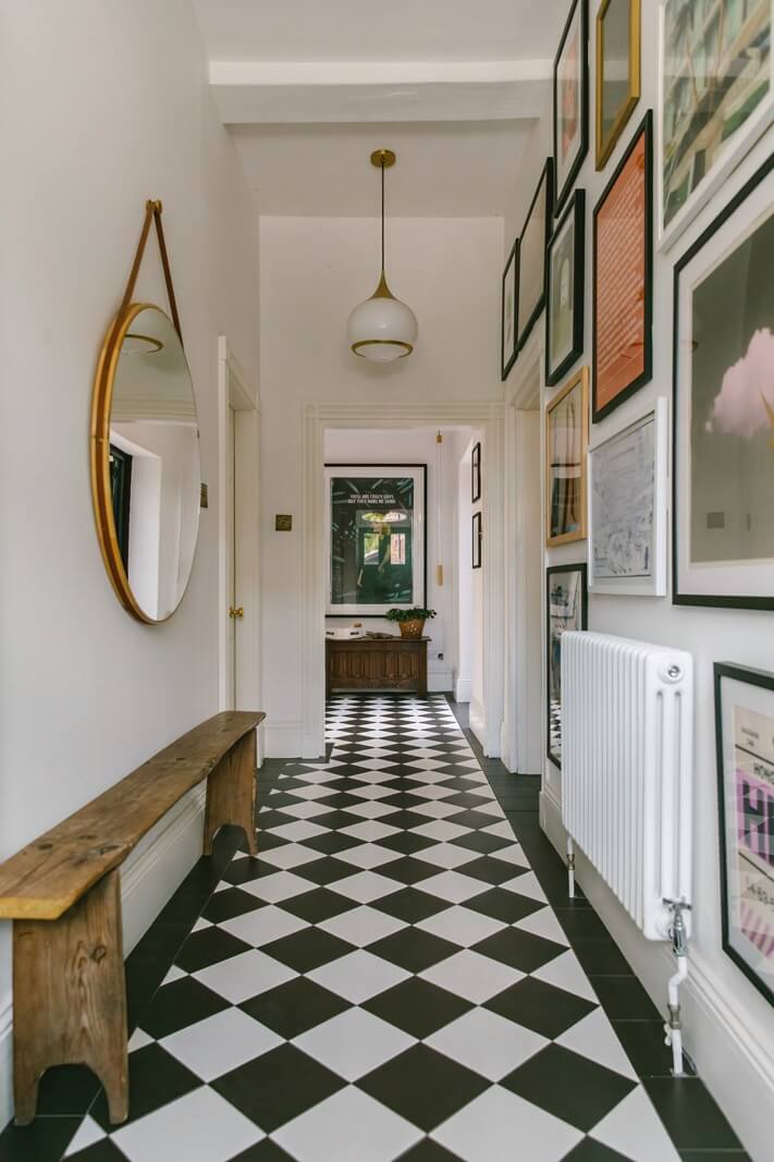 A Georgian House in England with Bold Color Pops 14 hallway-checkerboard-floor-wooden-bench-round-mirror-nordroom
