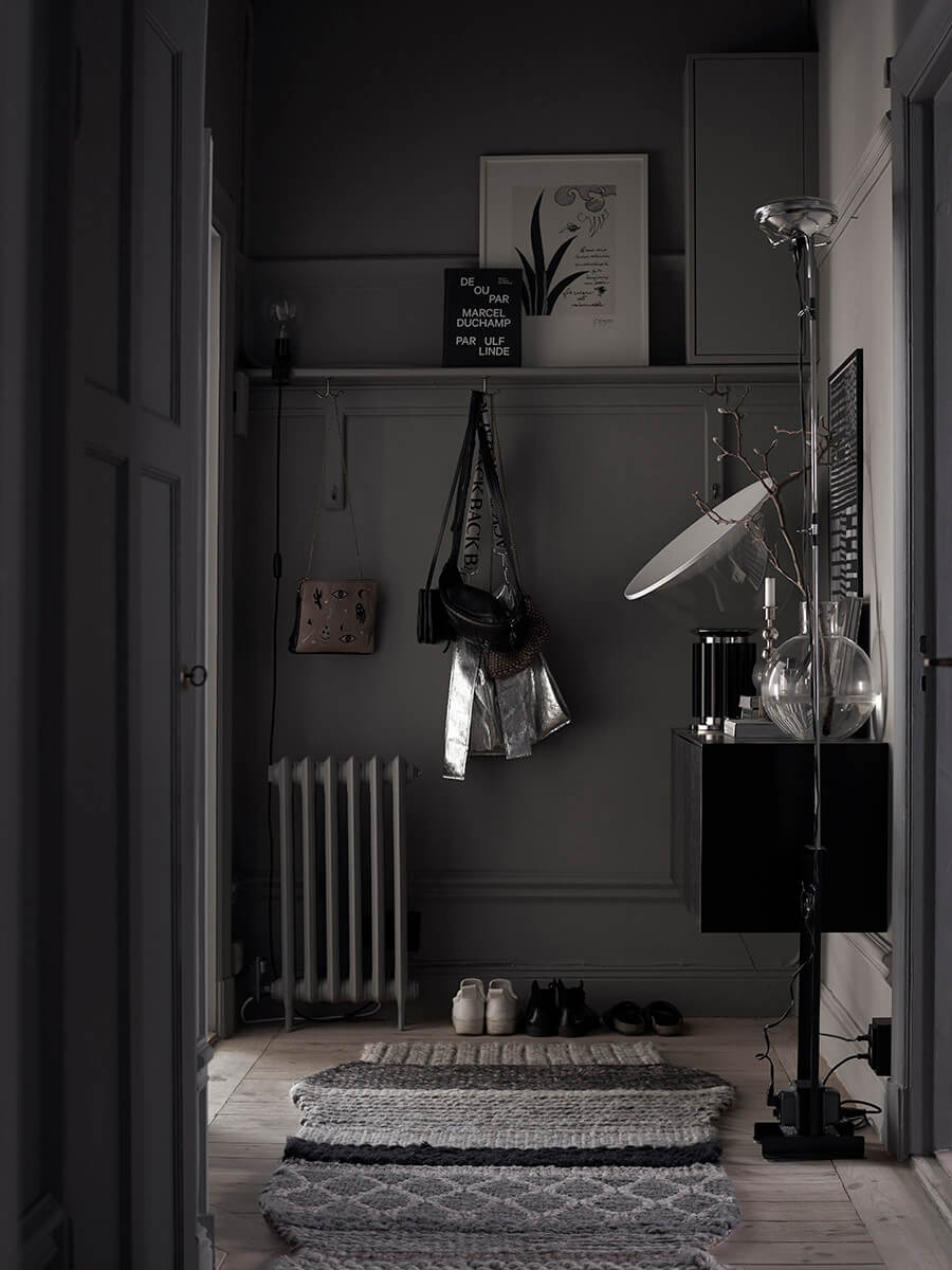Behr Color of the Year 2024: Cracked Pepper 19 hallway-dark-gray-walls-wooden-floor-lotta-agaton-nordroom