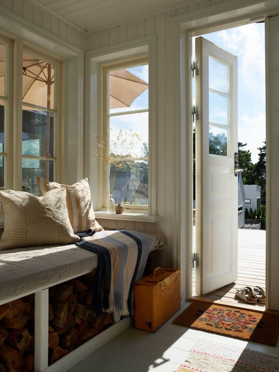 A Small Historic Swedish House with a Modern Extension 16 hallway-with-bench-nordroom