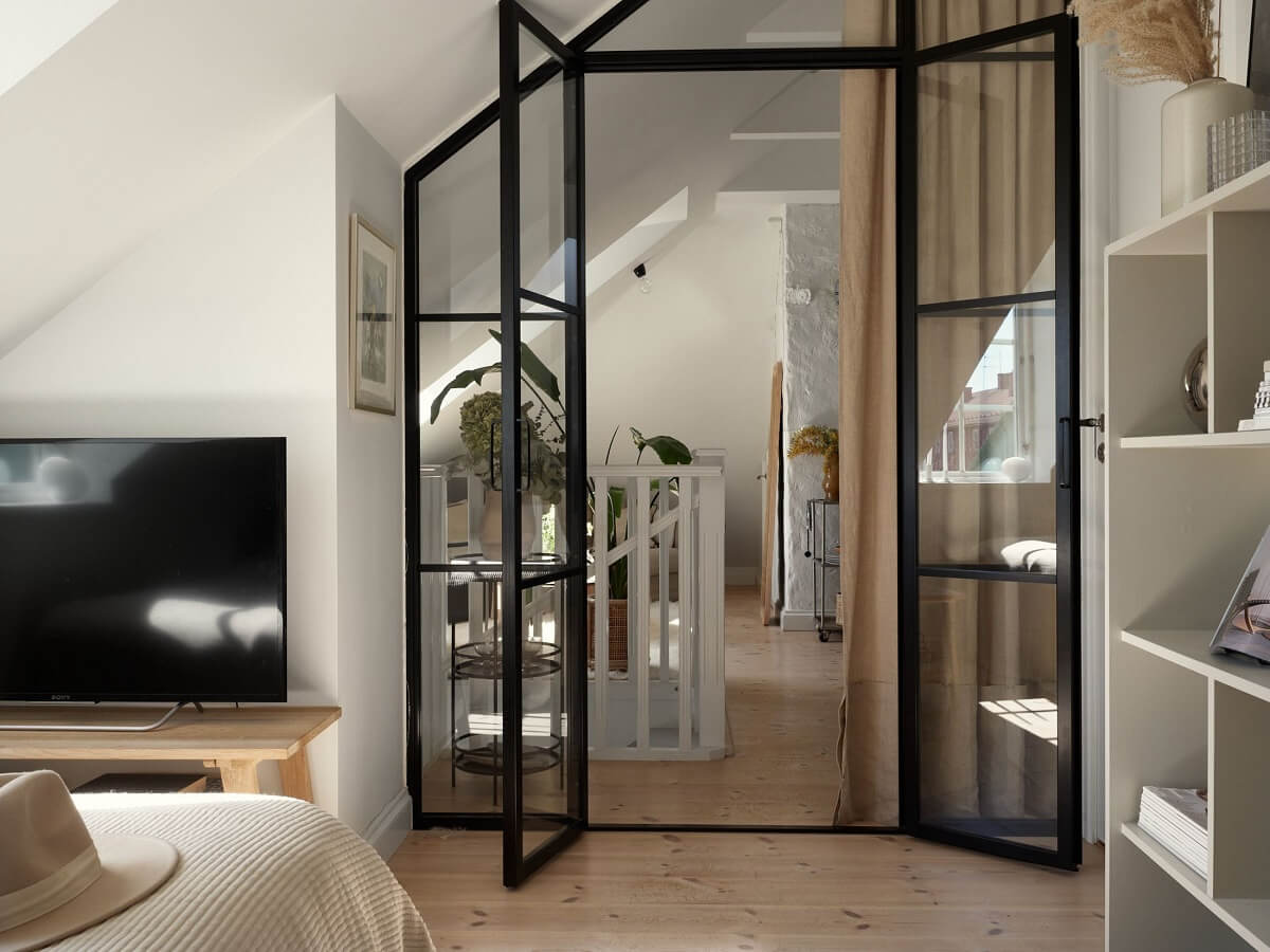 A Small Attic Apartment with Industrial Glass walls 16 industrial-glass-doors-bedroom