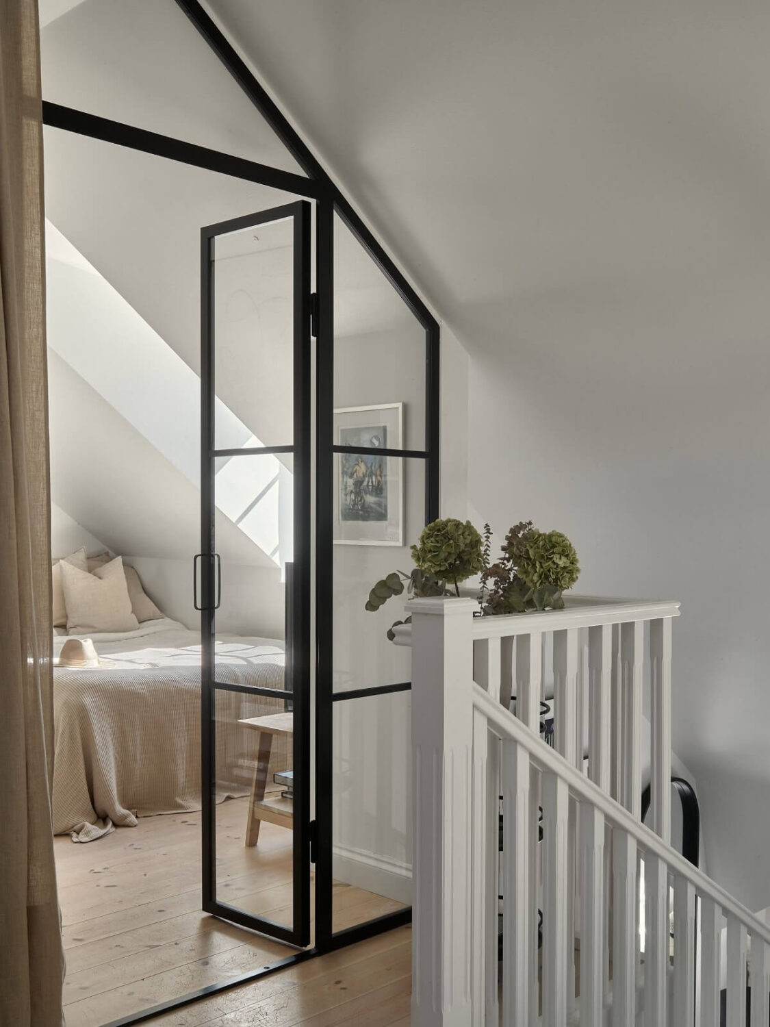 A Small Attic Apartment with Industrial Glass walls 12 industrial-glass-wall-bedroom-attic-apartment-nordroom
