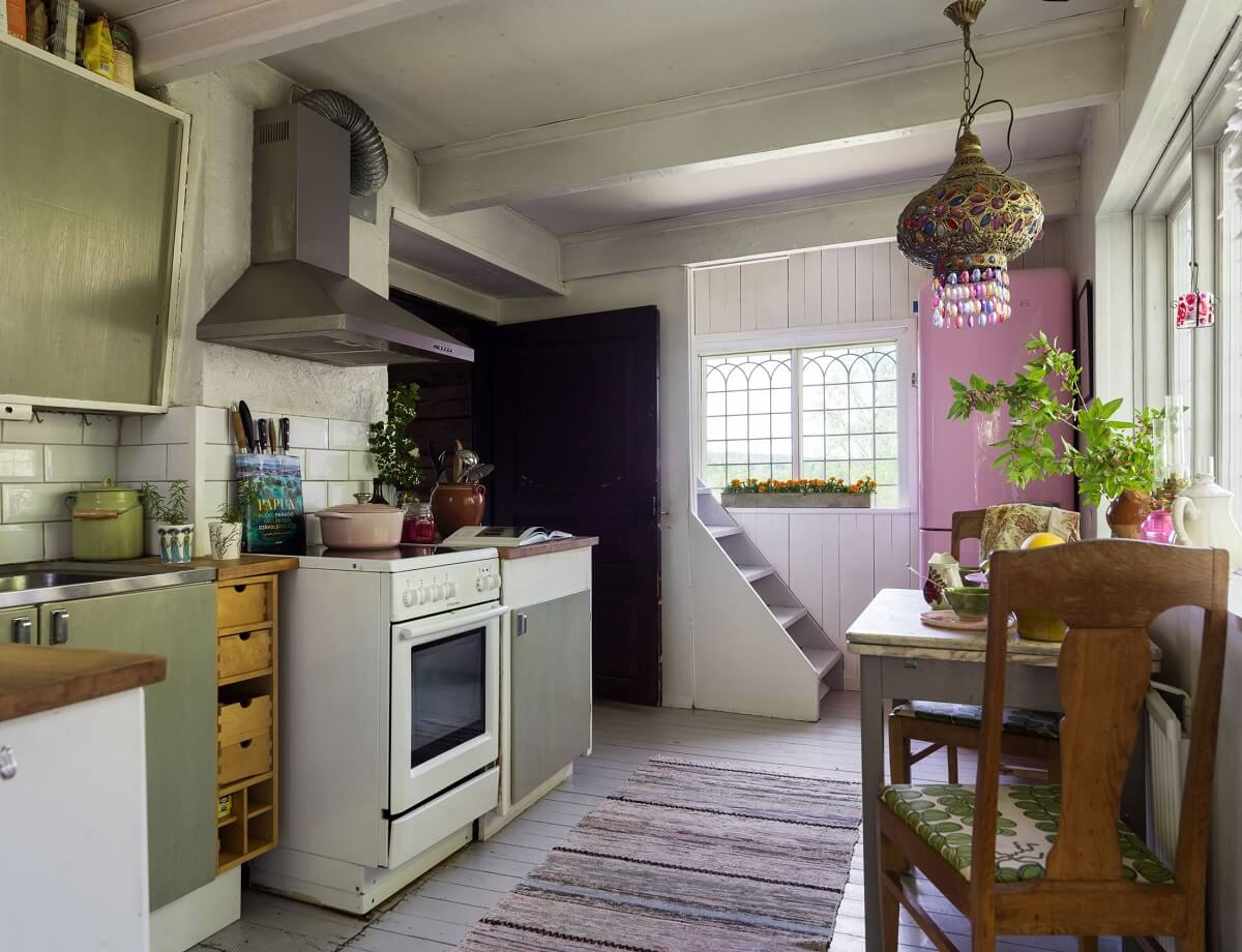 A Rustic Log Cabin With A Green Bathroom 3 kitchen-green-cabinets-log-cabin-sweden-nordroom