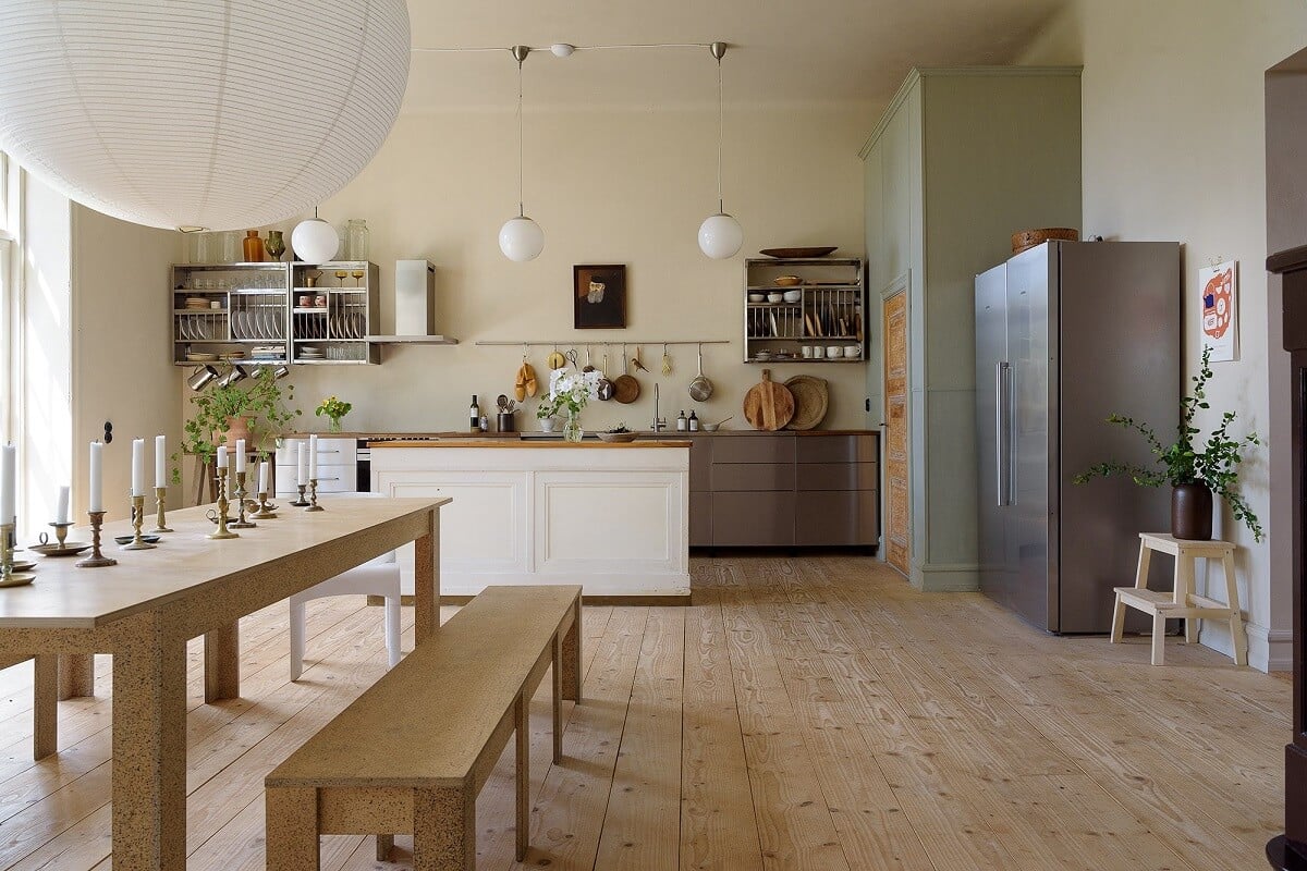 Natural Colors in a Swedish School Conversion 12 large-kitchen-stainless-steel-cabinets-wooden-dining-table-benches-nordroom