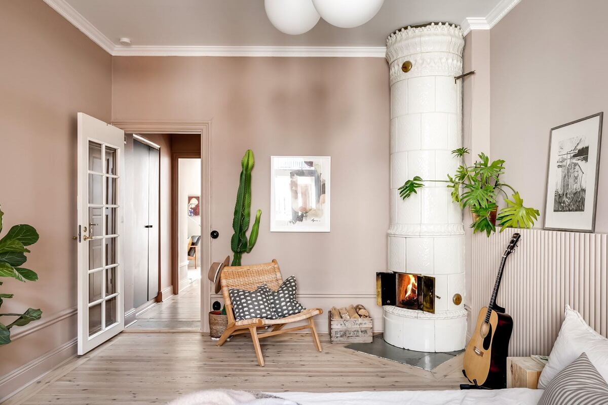 A Custom Headboard in a Light-Filled Swedish Apartment 22 large-master-bedroom-neutral-wall-color-fireplace-nordroom