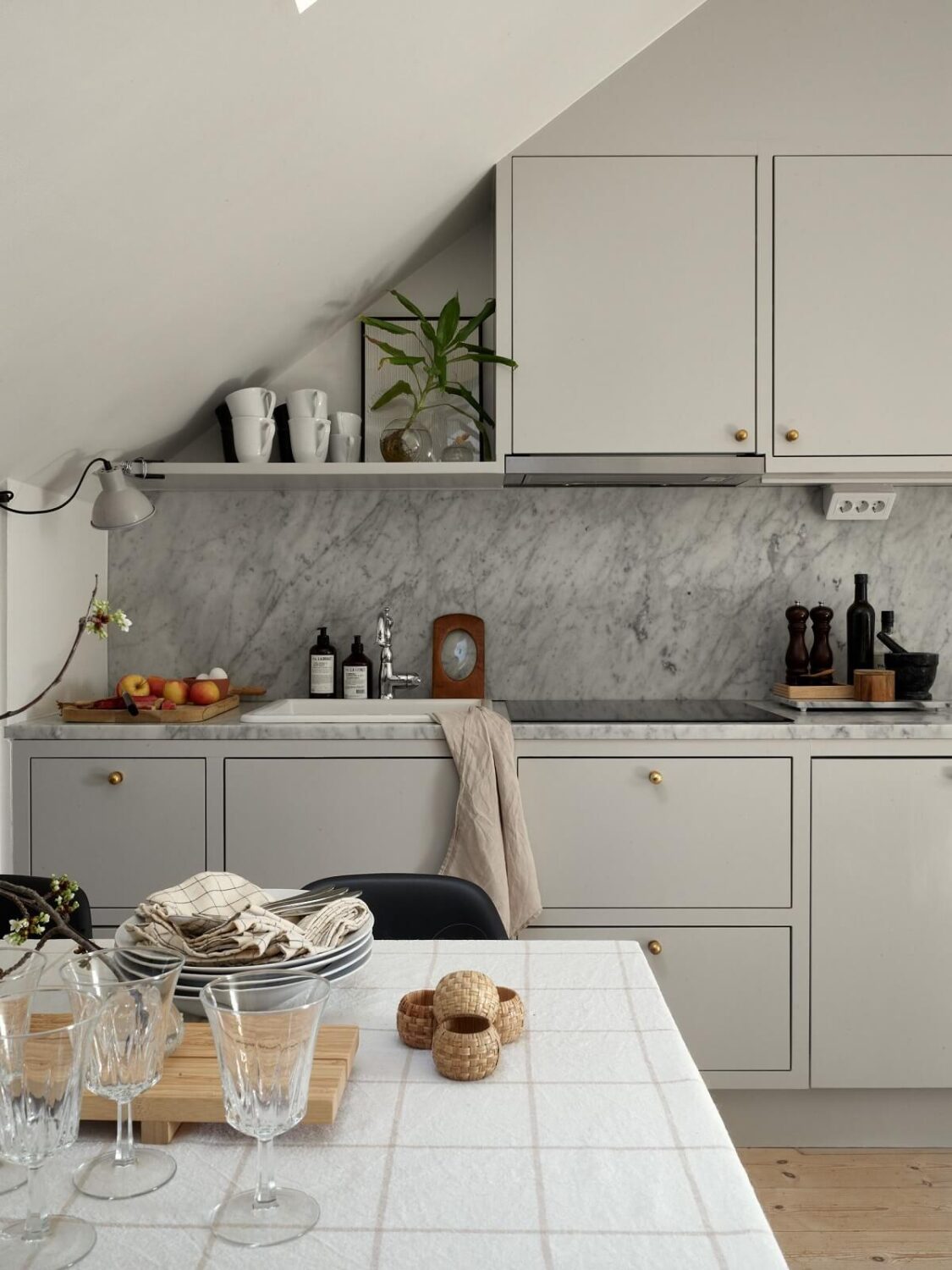 A Small Attic Apartment with Industrial Glass walls 8 light-gray-kitchen-marble-worktop-nordroom