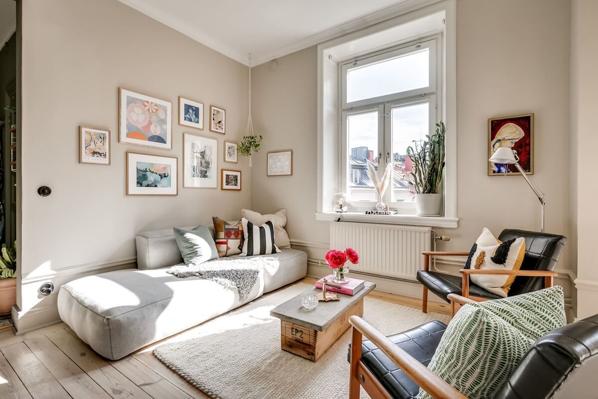 A Custom Headboard in a Light-Filled Swedish Apartment 4 light-living-room-beige-walls-nordroom