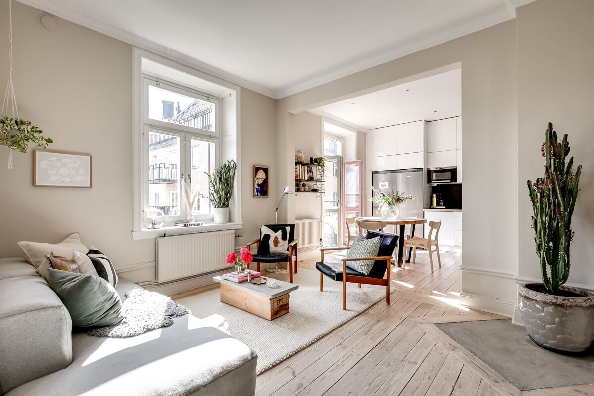 A Custom Headboard in a Light-Filled Swedish Apartment 5 light-open-plan-living-room-wooden-floor-nordroom